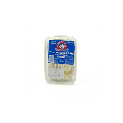 Stringy Haloumi cheese from Chtaura, 450g, displayed in a fridge, with slices showing its firm, elastic texture.