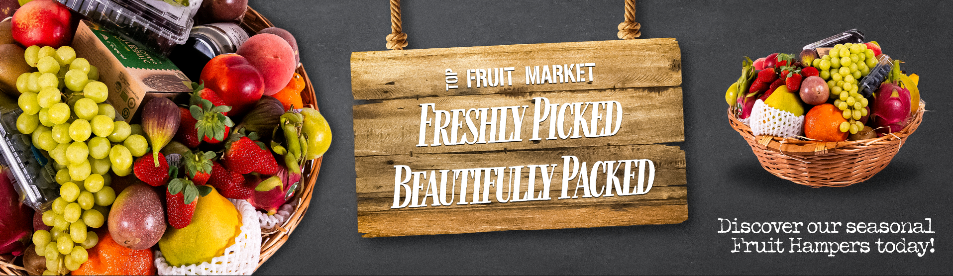 Fruit market sign with fruits and a basket of fruit on a dark background