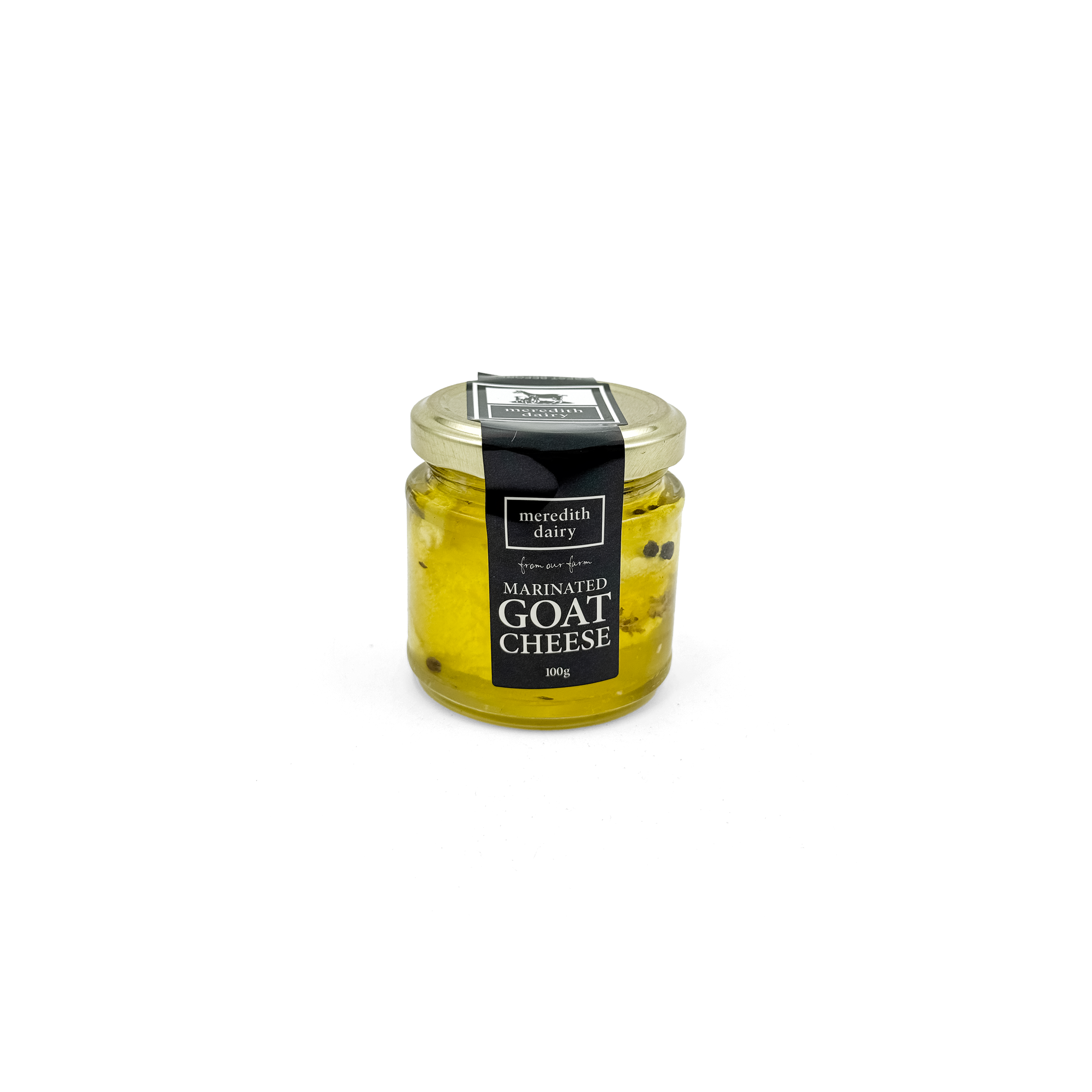 Marinated goat cheese from Meredith Dairy in a 100g fridge-friendly package, showcasing creamy cheese with herbs and spices.