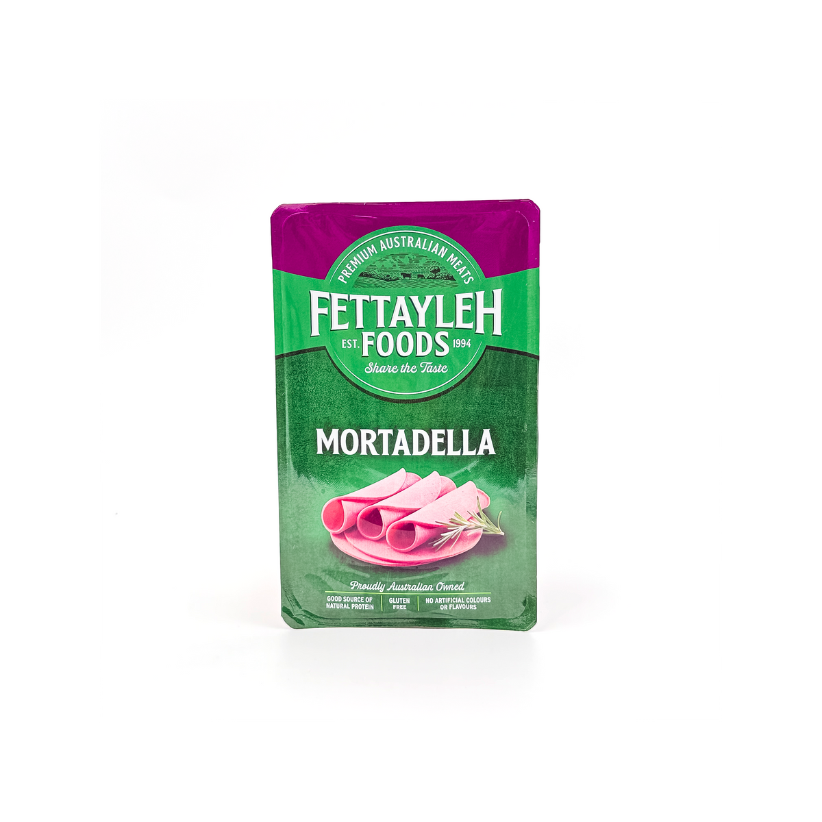 Slices of Fettayleh Mortadella from Top Fruit Market displayed in a fridge, showcasing the Italian deli meat's smooth texture and pink color.
