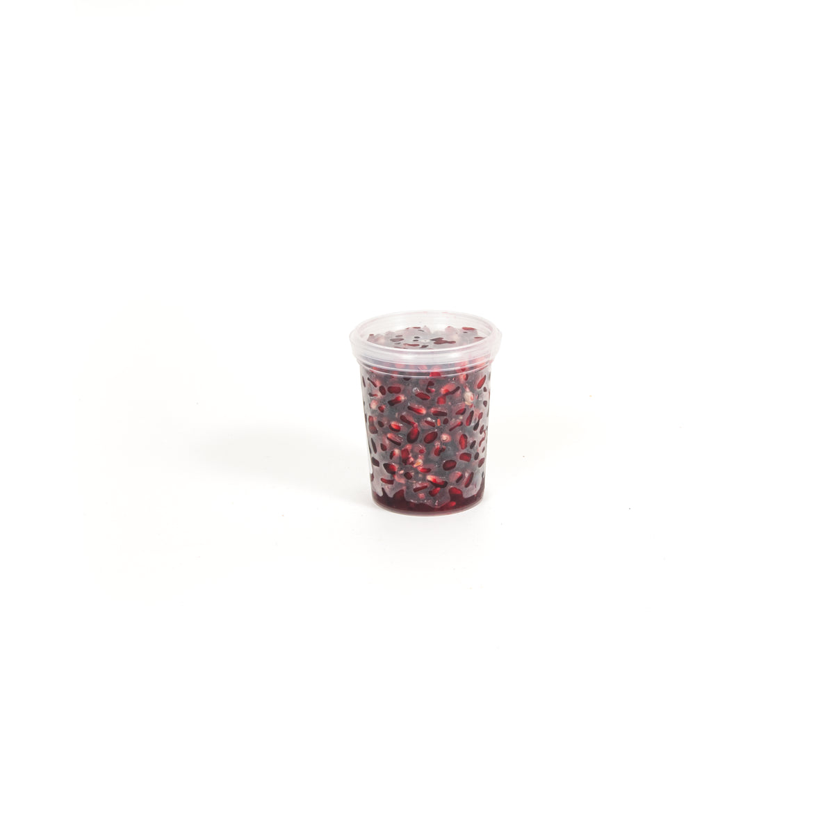 Small tub of fresh pomegranate seeds from Top Fruit Market, showcasing vibrant red seeds in a clear container.